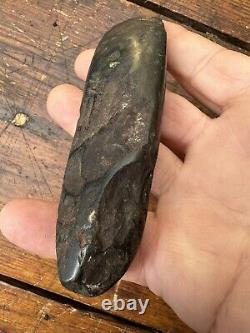 A small and fine old Papua New Guinea Black Stone Tool Axe Adze Head
