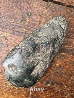 A very old Black Stone Axe Head Papua New Guinea