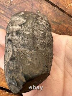 A very old Black Stone Axe Head Papua New Guinea