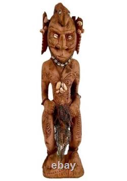 Antique Carved Papua New Guinea Cowrie Eyed Chief Wearing A Lizard Head Dress
