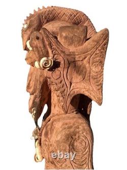 Antique Carved Papua New Guinea Cowrie Eyed Chief Wearing A Lizard Head Dress