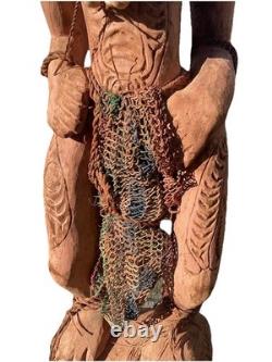 Antique Carved Papua New Guinea Cowrie Eyed Chief Wearing A Lizard Head Dress