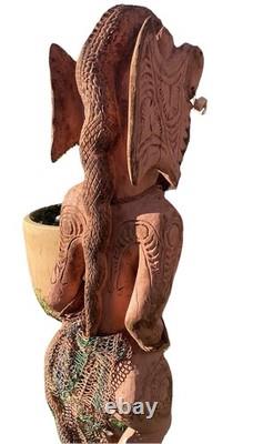 Antique Carved Papua New Guinea Cowrie Eyed Chief Wearing A Lizard Head Dress