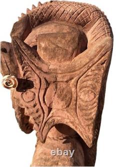 Antique Carved Papua New Guinea Cowrie Eyed Chief Wearing A Lizard Head Dress
