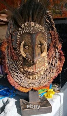 Early Papau New Guinea Mask On Stand Profusely Decorated, On Stand