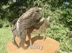 Metal sculpture of mating pigs from Papua New Guinea