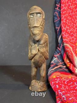 Old Papua New Guinea Carved Wooden Figure with Cowrie Shell Eyes