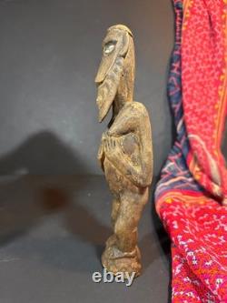 Old Papua New Guinea Carved Wooden Figure with Cowrie Shell Eyes