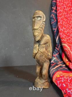 Old Papua New Guinea Carved Wooden Figure with Cowrie Shell Eyes