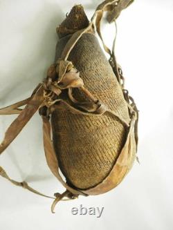 Old Papua New Guinea Hemp Woven Water Canteen with cowrie shells, Pitch, & Leather