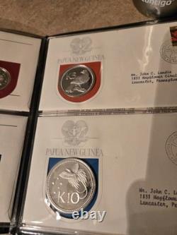Papua New Guinea Coin and Stamp Sets. (AFIT 555)