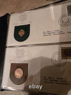 Papua New Guinea Coin and Stamp Sets. (AFIT 555)