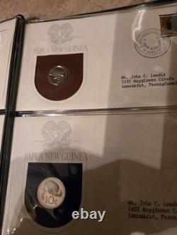 Papua New Guinea Coin and Stamp Sets. (AFIT 555)