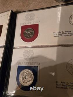 Papua New Guinea Coin and Stamp Sets. (AFIT 555)