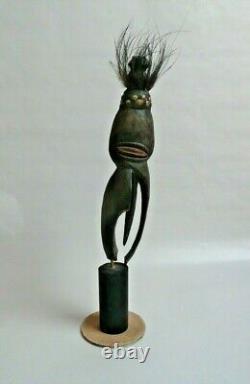 Papua New Guinea Sepik ancestor figure with cowrie shell and feather decorations