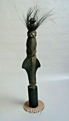 Papua New Guinea Sepik ancestor figure with cowrie shell and feather decorations