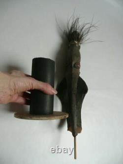 Papua New Guinea Sepik ancestor figure with cowrie shell and feather decorations