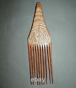 Papua New Guinea comb, wood, carved face