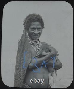 Photograph UNANA WOMAN WITH PIG PAPUA NEW GUINEA DATED 1906 Magic Lantern Slide