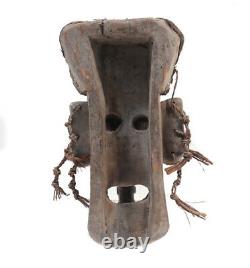 Sepik River Papua New Guinea Mask, with tusks and cowrie shells, woven grass