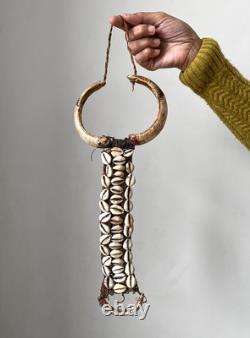 West Papua, Asmat people, wild boar tusk breast ornament, New Guinea