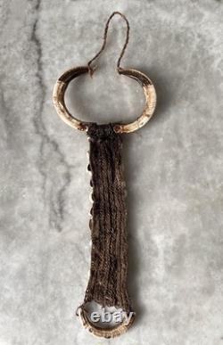 West Papua, Asmat people, wild boar tusk breast ornament, New Guinea