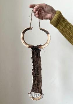 West Papua, Asmat people, wild boar tusk breast ornament, New Guinea