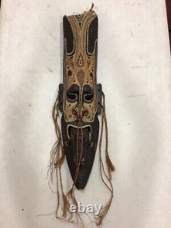 Wooden Sculpture of a face from tribes on the Sepik River in Papua New Guinea